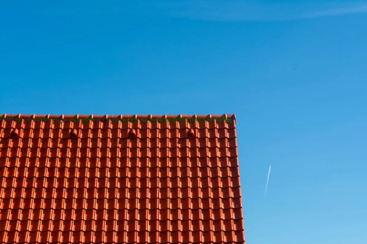 Tile roof gable in full sun, the kind of exposure that sets roof life in Blue Springs, MO